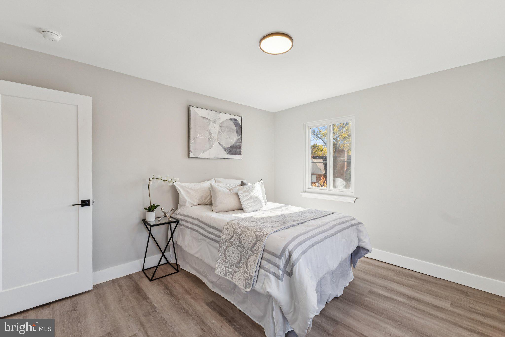 10101 Greeley Avenue Silver Spring, MD 20902 - Photo 7 of 25 a bedroom with a bed and a window