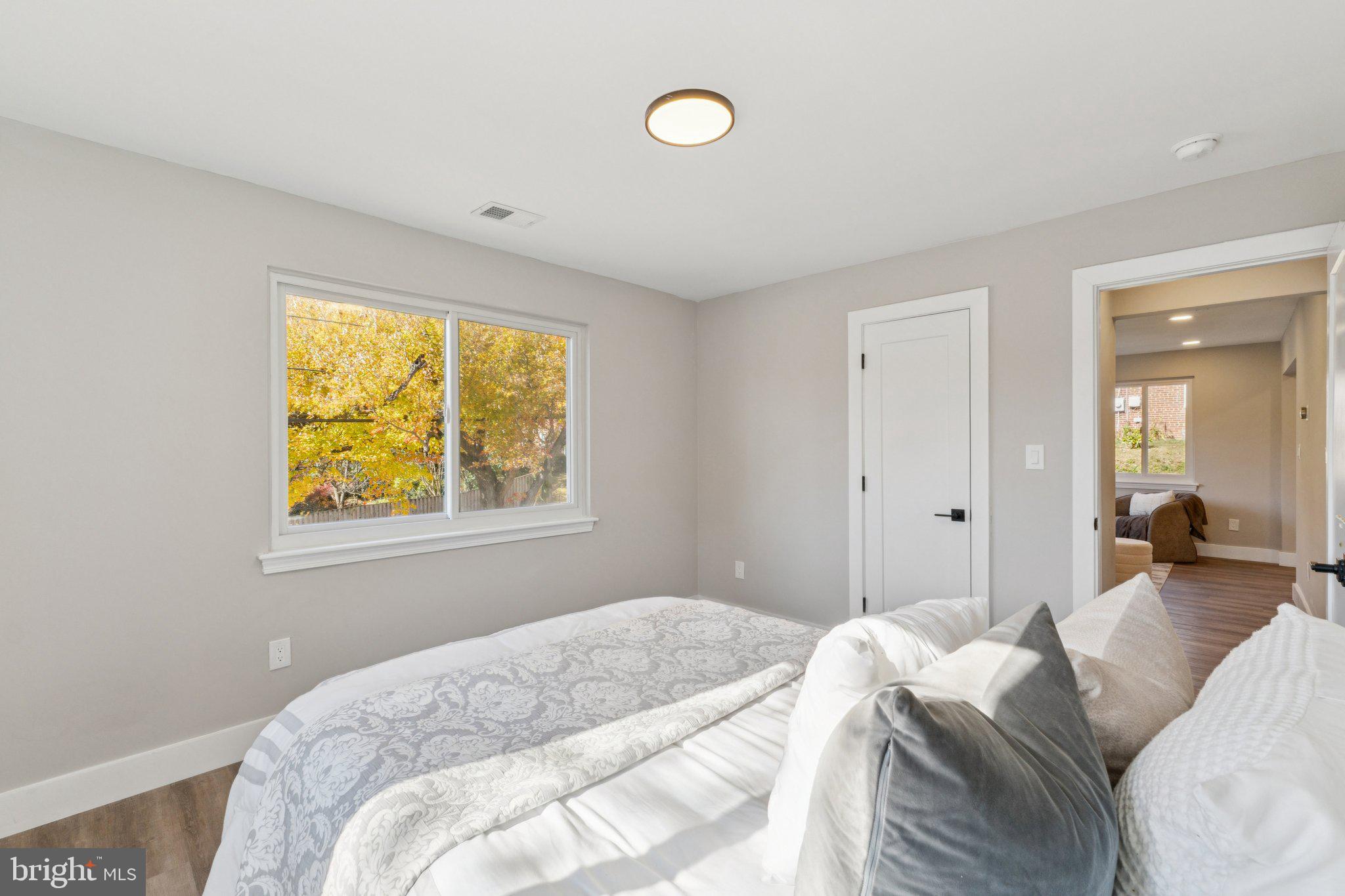 10101 Greeley Avenue Silver Spring, MD 20902 - Photo 9 of 25 a bedroom with a bed and a window