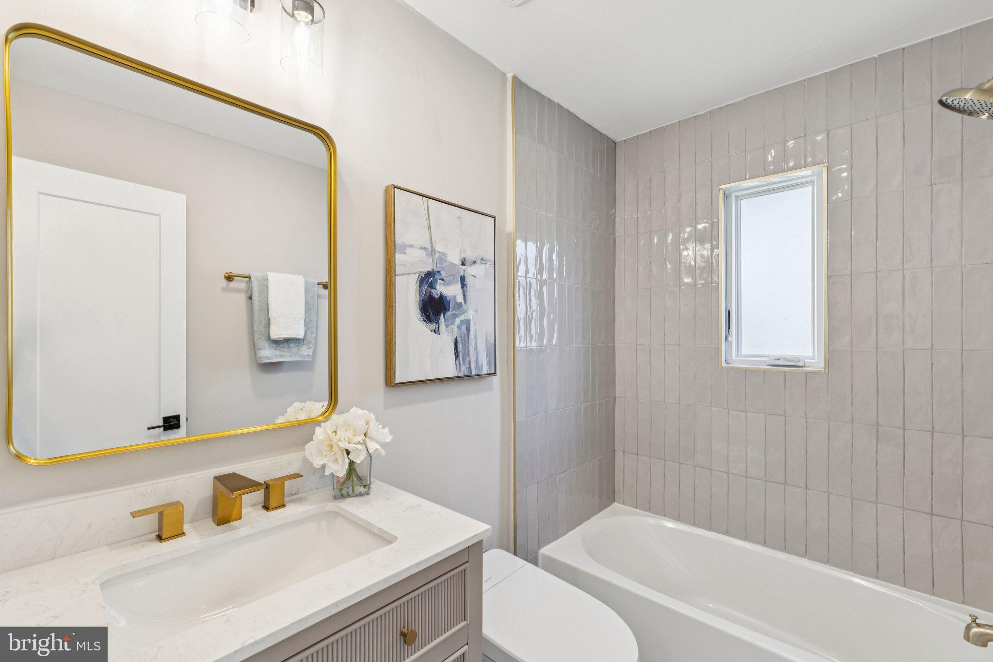 10101 Greeley Avenue Silver Spring, MD 20902 - Photo 10 of 25 a bathroom with a sink a toilet and shower