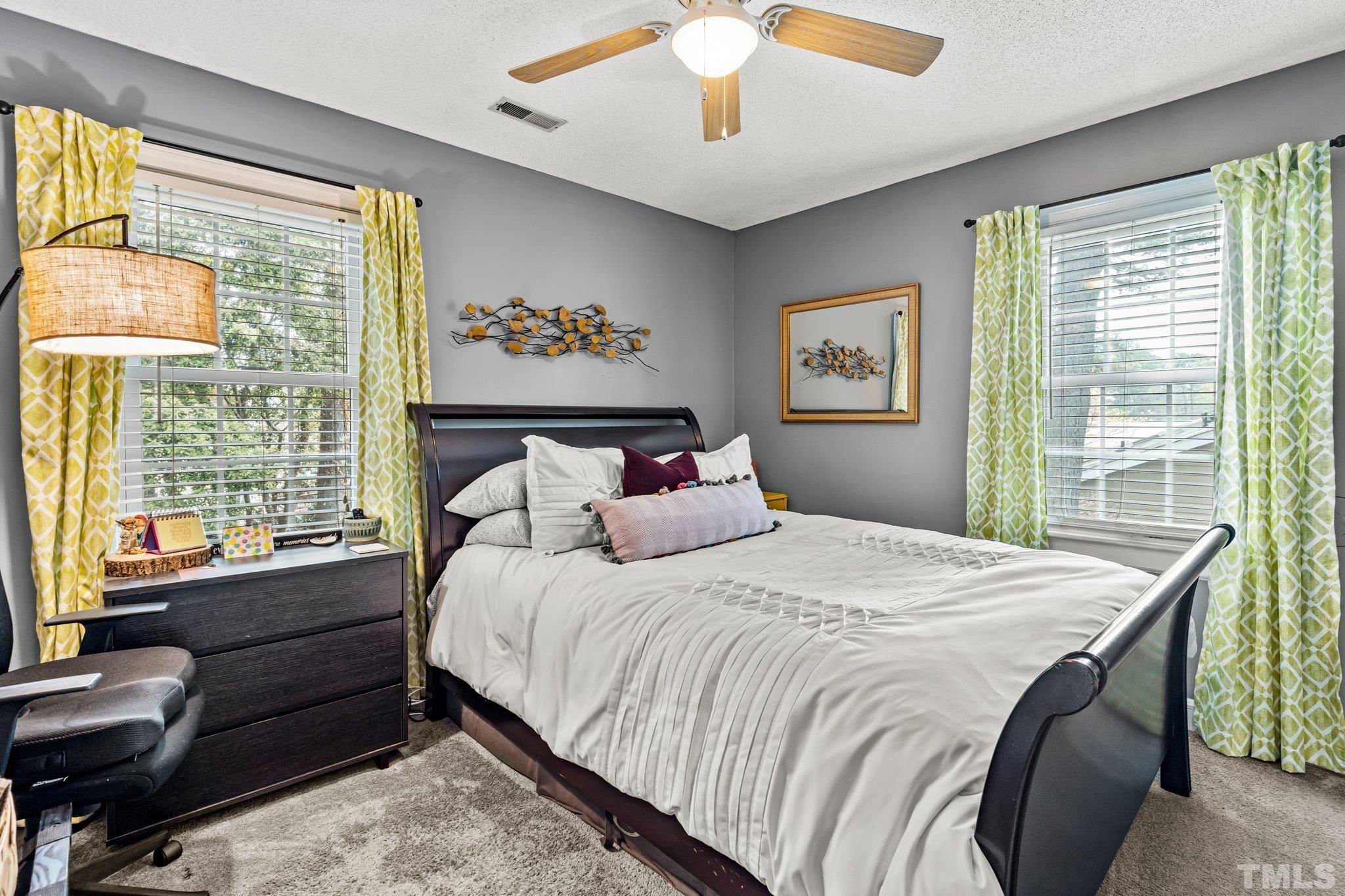6212 Wynbrook Way Raleigh, NC 27612 - Photo 16 of 45 a bedroom with a bed and a window