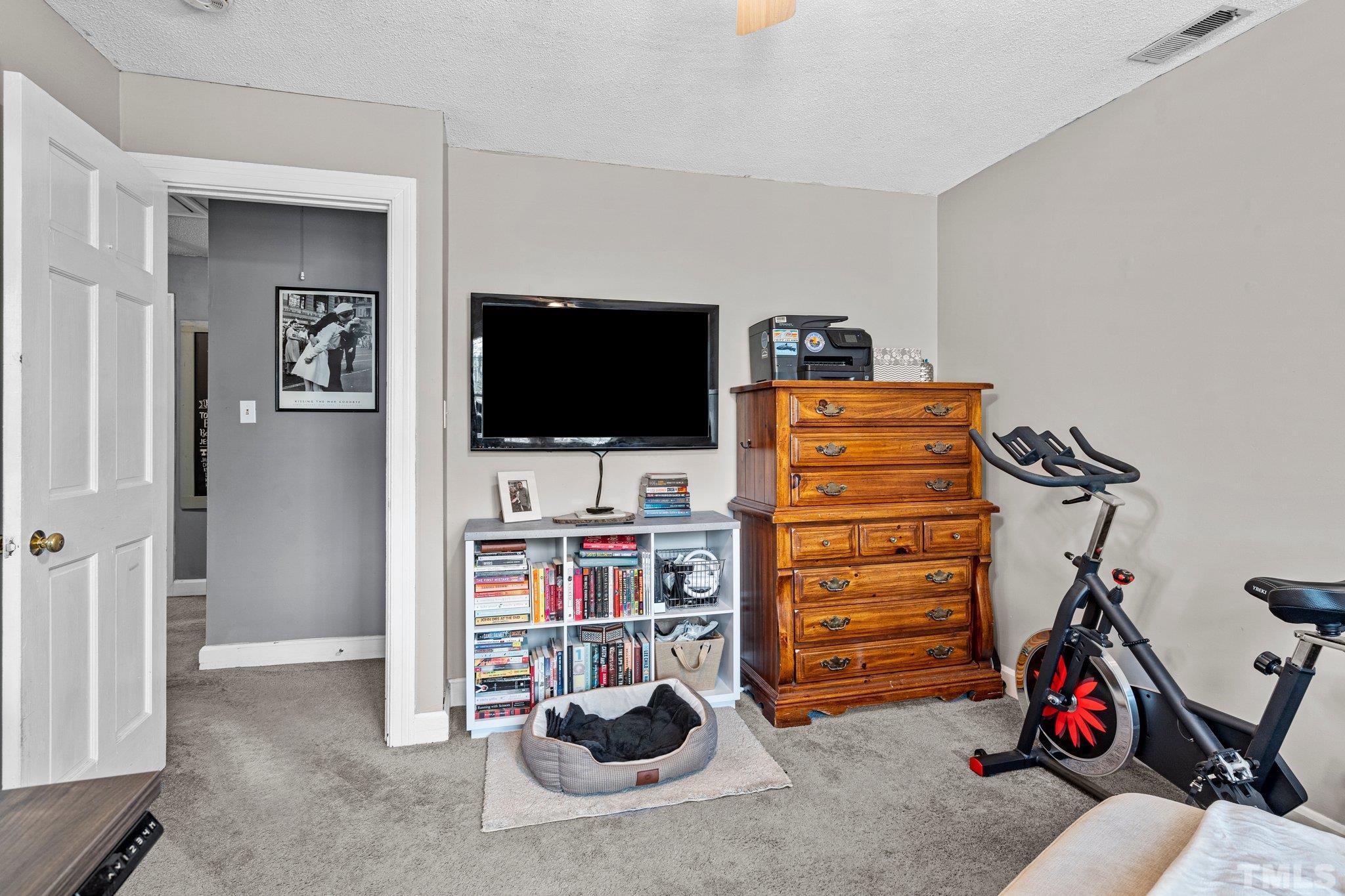 6212 Wynbrook Way Raleigh, NC 27612 - Photo 25 of 45 a view of a livingroom with a flat screen tv