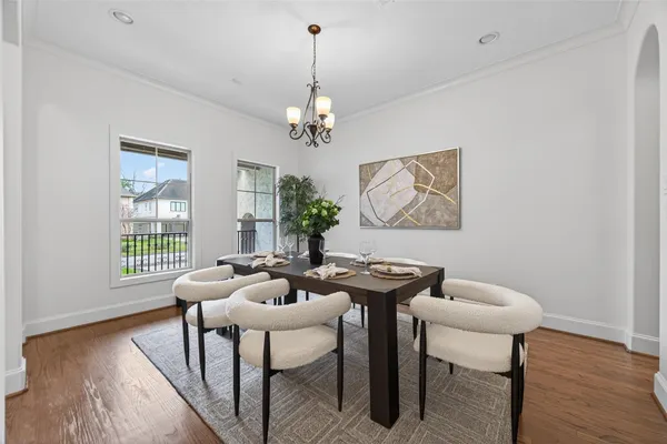 a large white kitchen with a large window