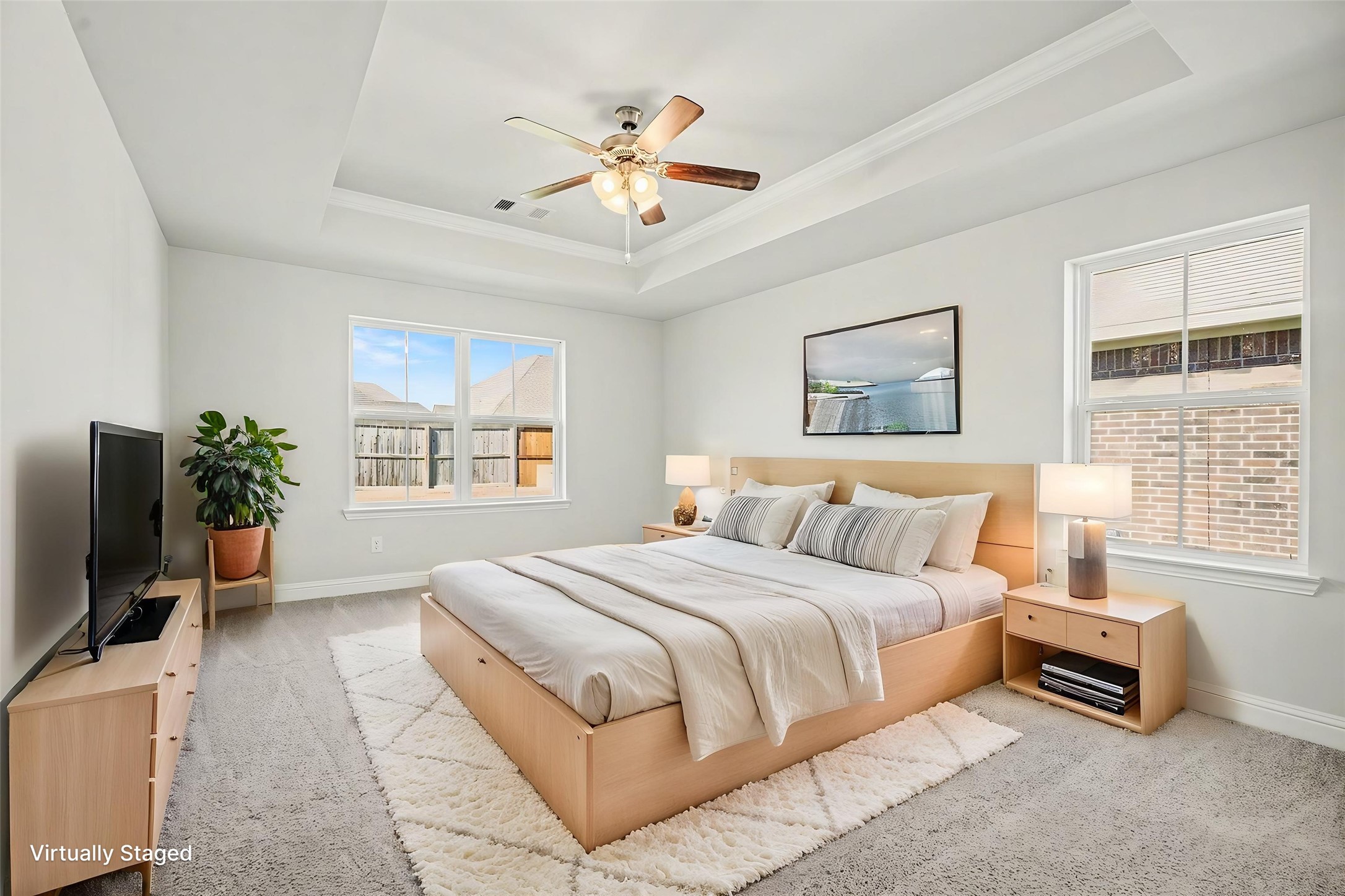 5 Keystone Court Angleton, TX 77515 - Photo 22 of 33 a spacious bedroom with a bed and a flat screen tv