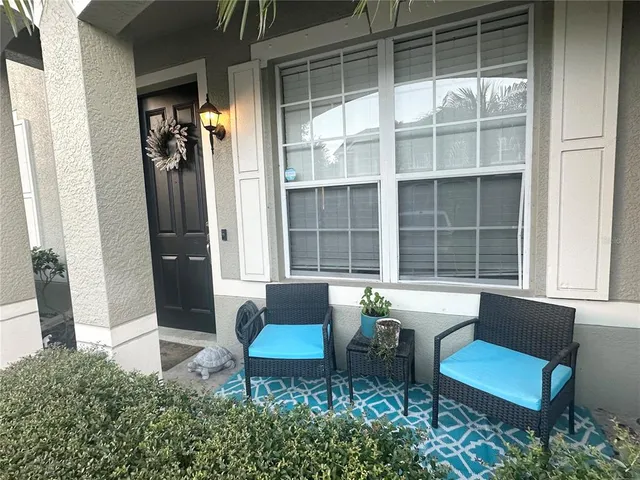 a outdoor living space with furniture and a gate