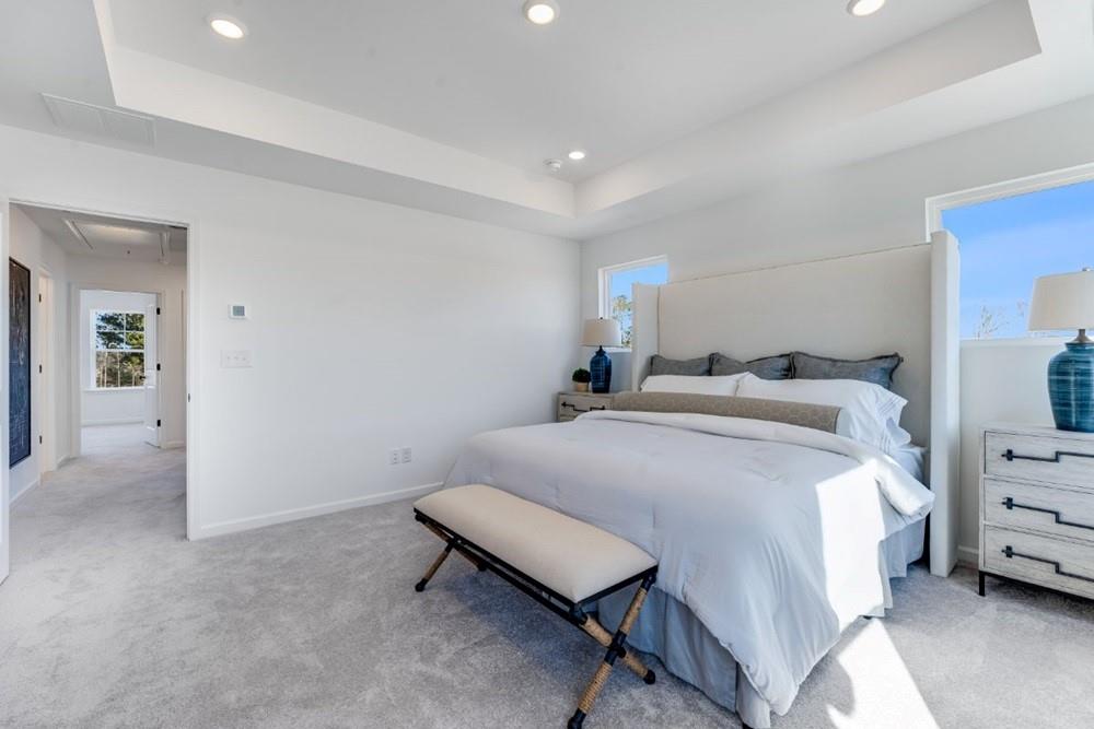 3195 Eastham Run Drive Dacula, GA 30019 - Photo 26 of 35 a bedroom with a bed and a chair