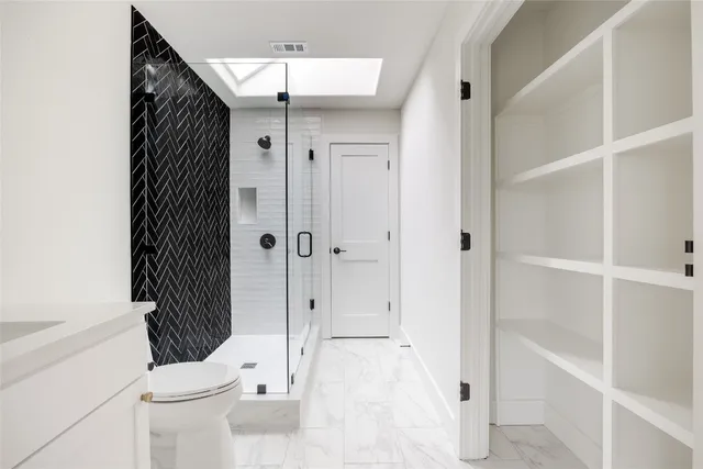 a bathroom with a bathtub and a shower