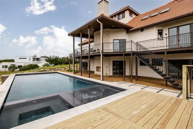 a view of a house with pool on the background