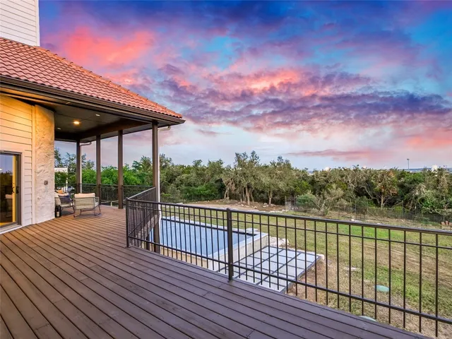 a view of a patio with a table & chairs