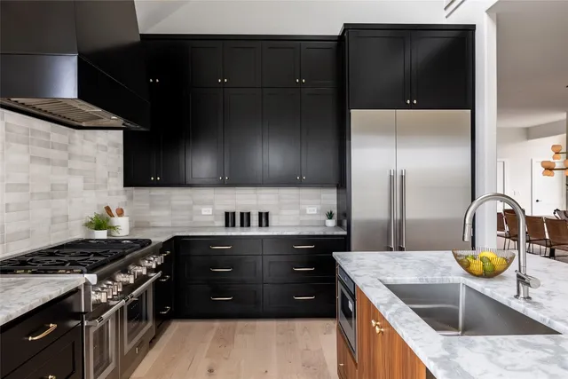 a kitchen with a stove and a sink