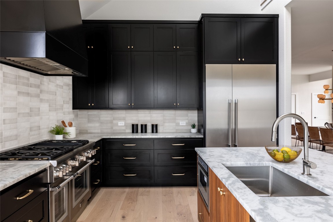 3901 Peak Lookout Drive Austin, TX 78738 - Photo 8 of 15 a kitchen with a stove and a sink