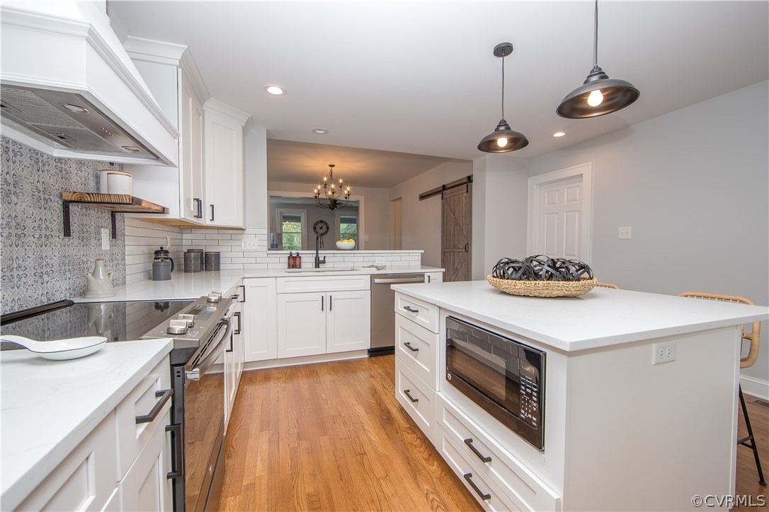 4213 Brook Road Richmond, VA 23227 - Photo 16 of 49 a kitchen with a sink stove and cabinets