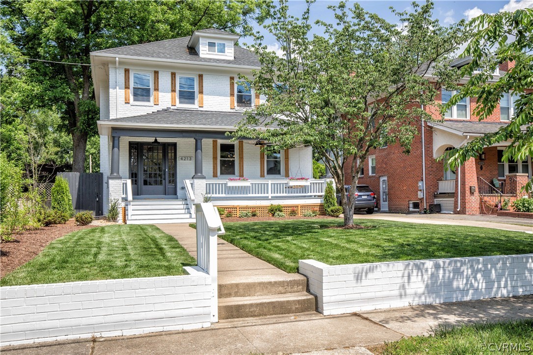 4213 Brook Road Richmond, VA 23227 - Photo 2 of 49 a front view of a house with a yard and garage
