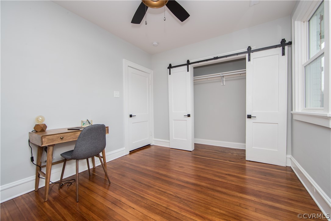 4213 Brook Road Richmond, VA 23227 - Photo 32 of 49 a view of workspace room with wooden floor wooden table and windows