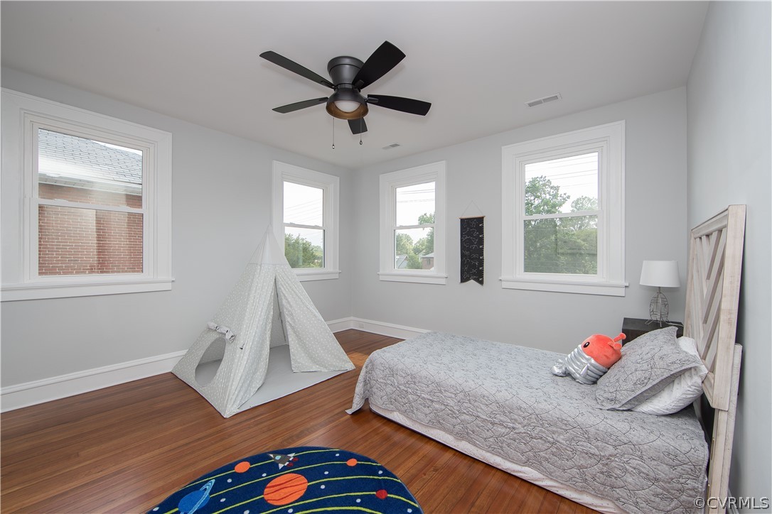 4213 Brook Road Richmond, VA 23227 - Photo 33 of 49 a bedroom with a bed and wooden floor