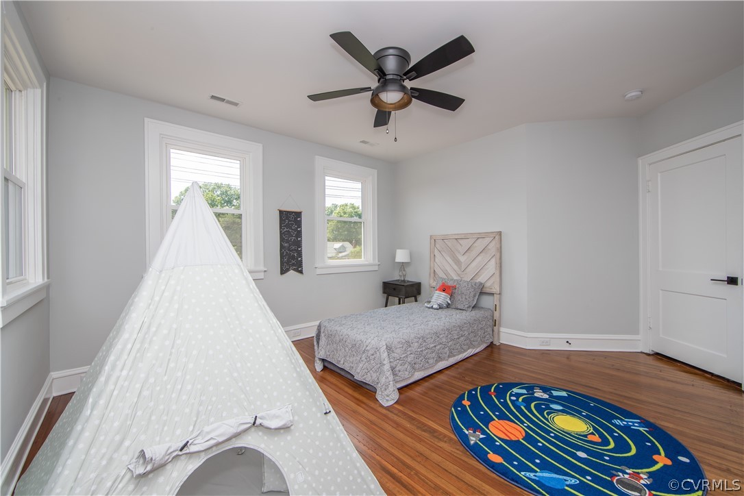 4213 Brook Road Richmond, VA 23227 - Photo 34 of 49 a living room with two bed and a wooden floor