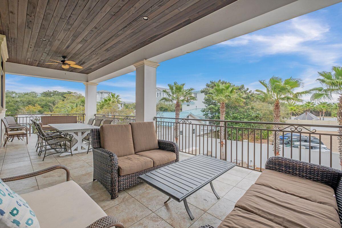 55 Sunfish Street Destin, FL 32541 - Photo 12 of 49 a balcony with furniture and a potted plant