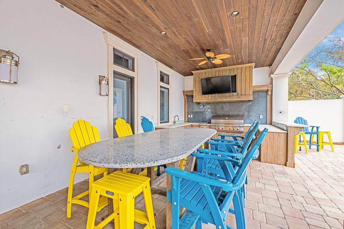 55 Sunfish Street Destin, FL 32541 - Photo 19 of 49 a dining room with furniture and a floor to ceiling window