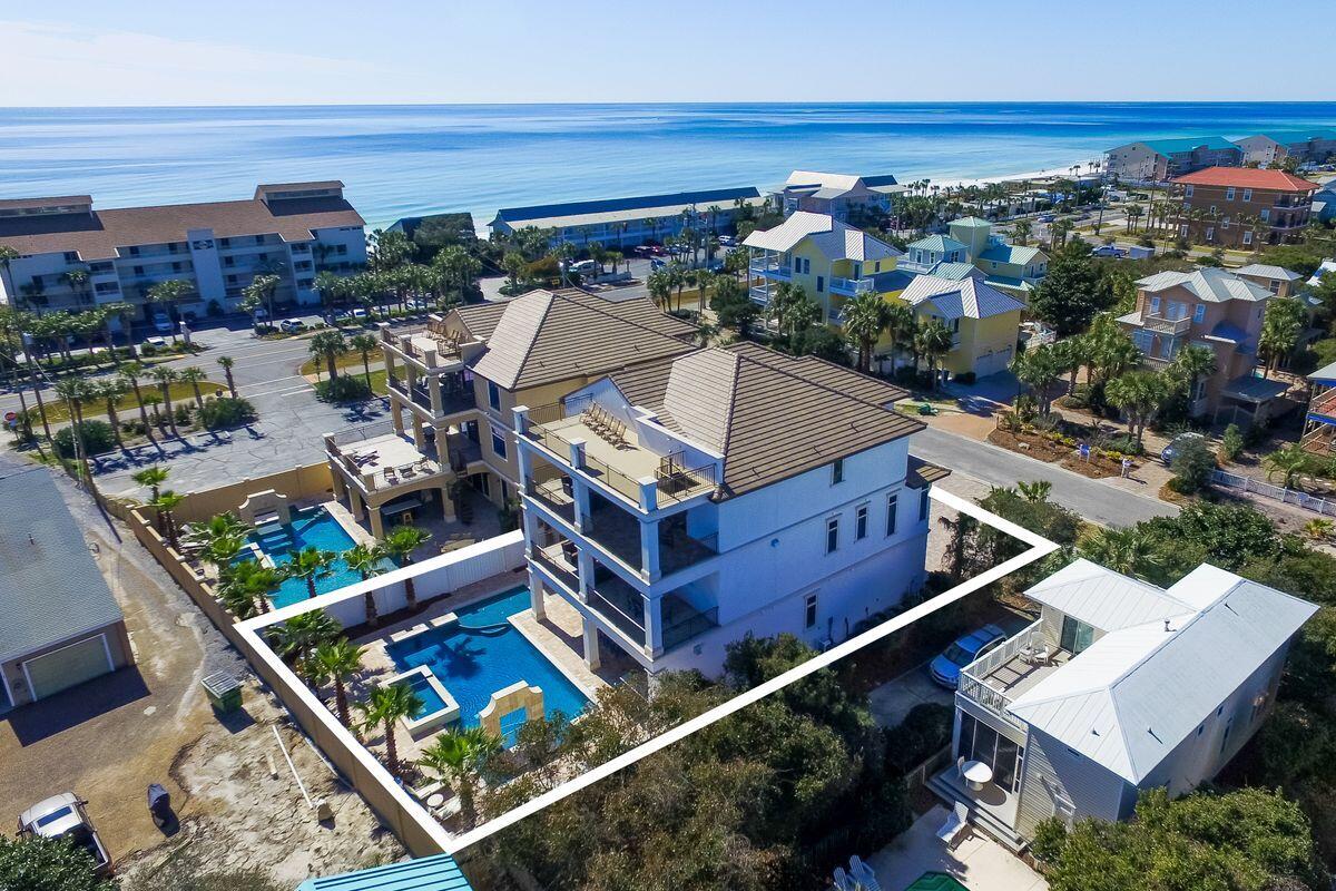 55 Sunfish Street Destin, FL 32541 - Photo 2 of 49 an aerial view of a house with a garden