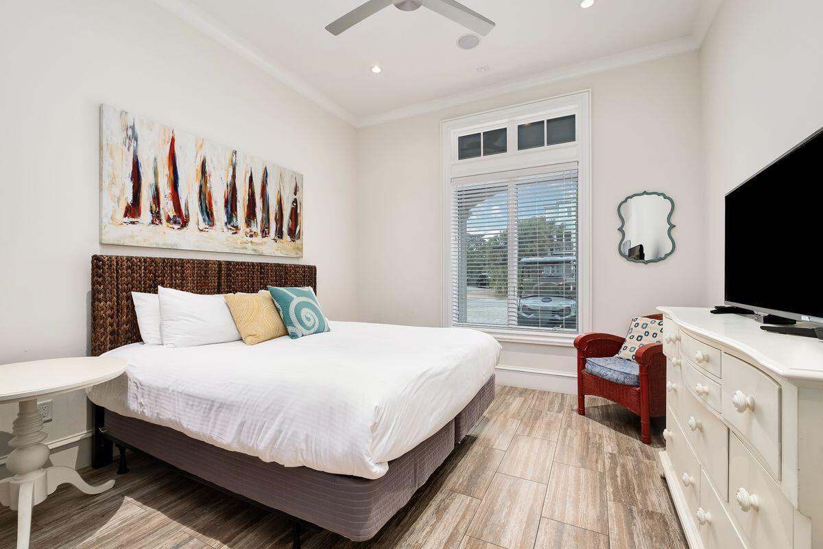 55 Sunfish Street Destin, FL 32541 - Photo 24 of 49 a bedroom with a bed and a flat screen tv