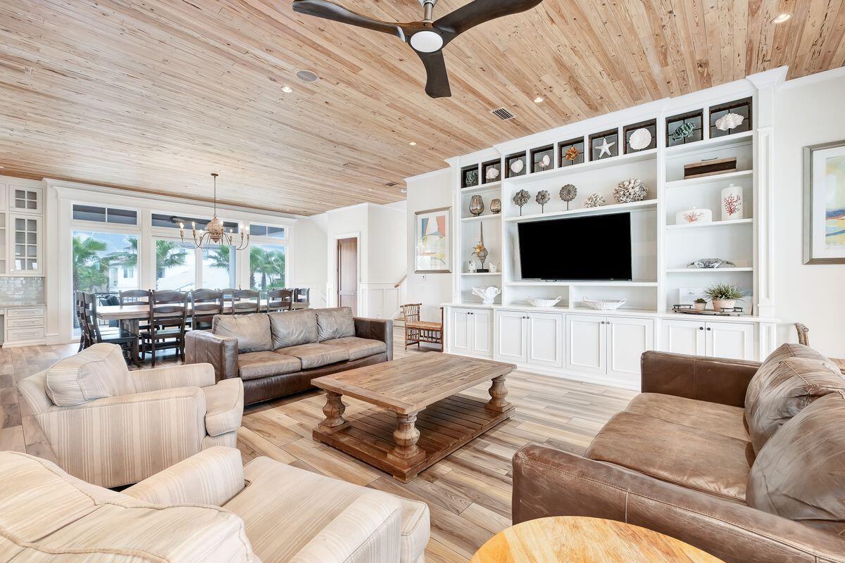 55 Sunfish Street Destin, FL 32541 - Photo 3 of 49 a living room with furniture fireplace and a flat screen tv