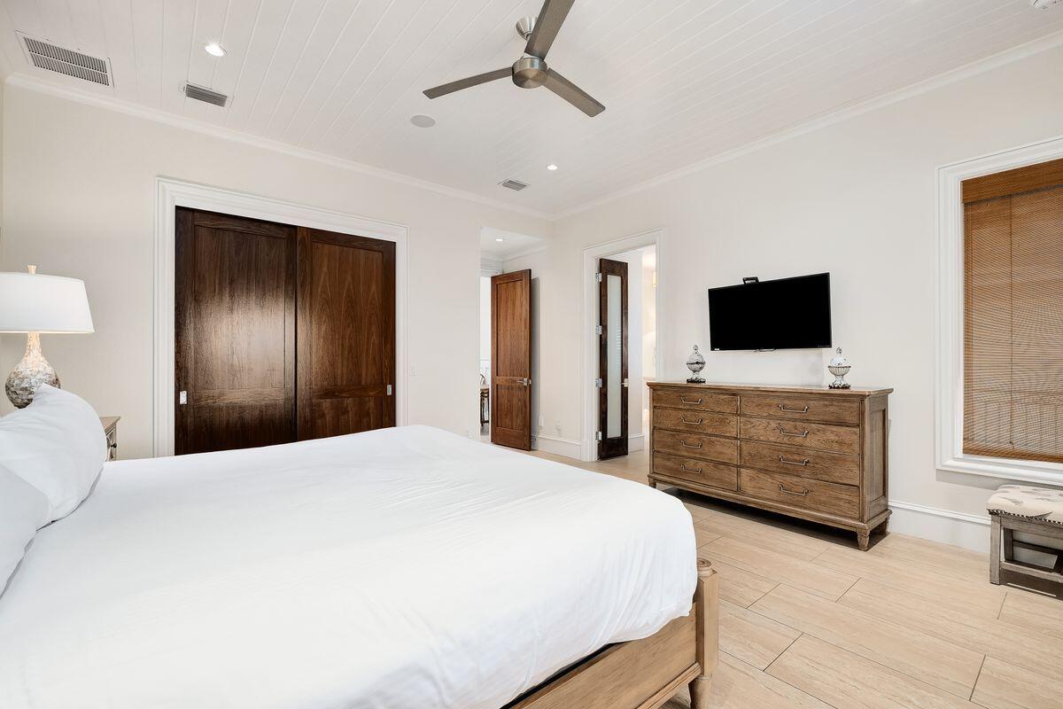 55 Sunfish Street Destin, FL 32541 - Photo 31 of 49 a bedroom with a bed and a flat screen tv