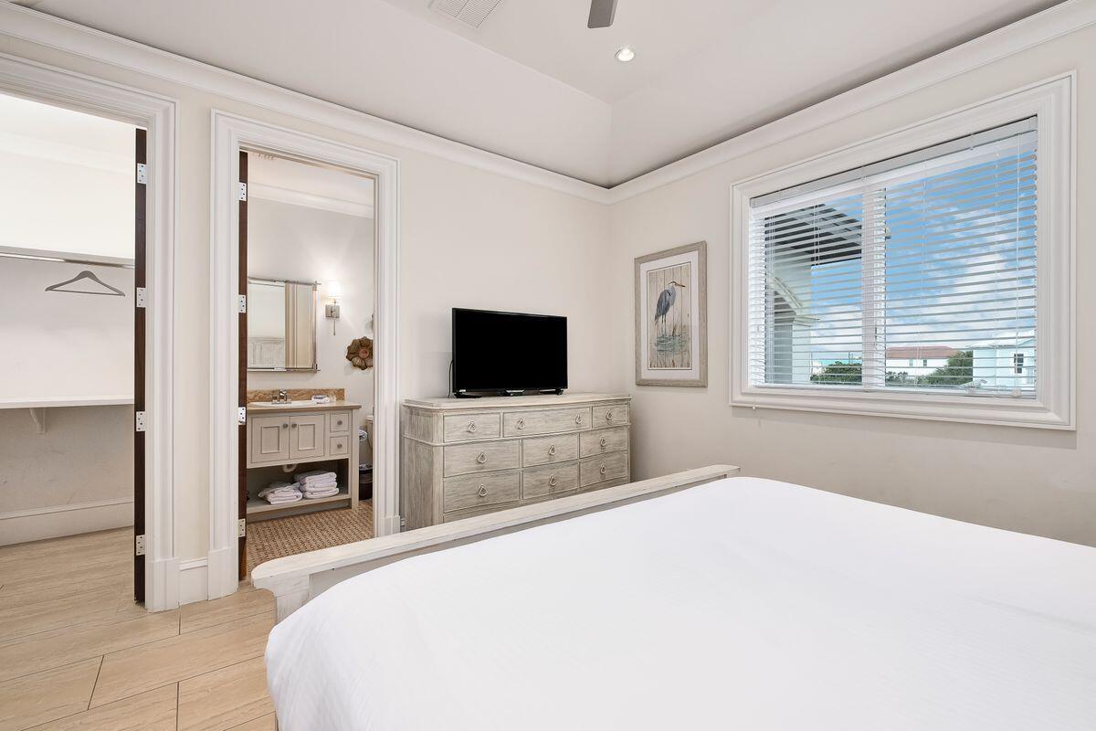 55 Sunfish Street Destin, FL 32541 - Photo 40 of 49 a bedroom with a bed and a flat screen tv