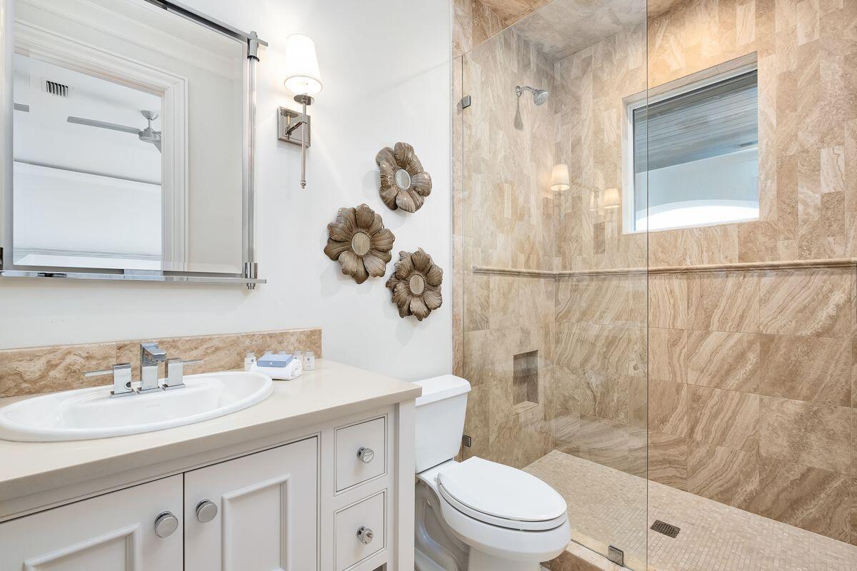 55 Sunfish Street Destin, FL 32541 - Photo 41 of 49 a bathroom with a sink a toilet and shower