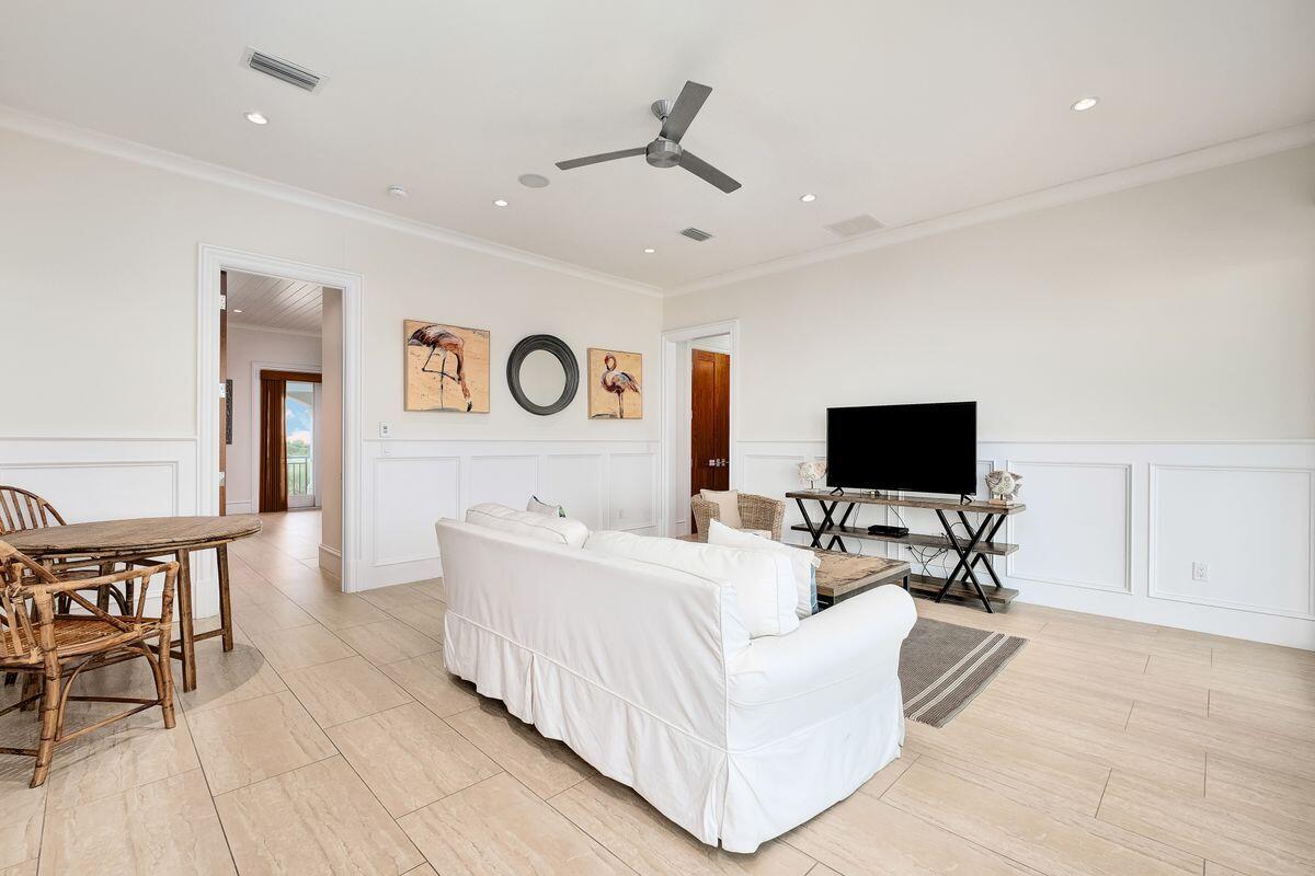 55 Sunfish Street Destin, FL 32541 - Photo 42 of 49 a living room with furniture and a flat screen tv