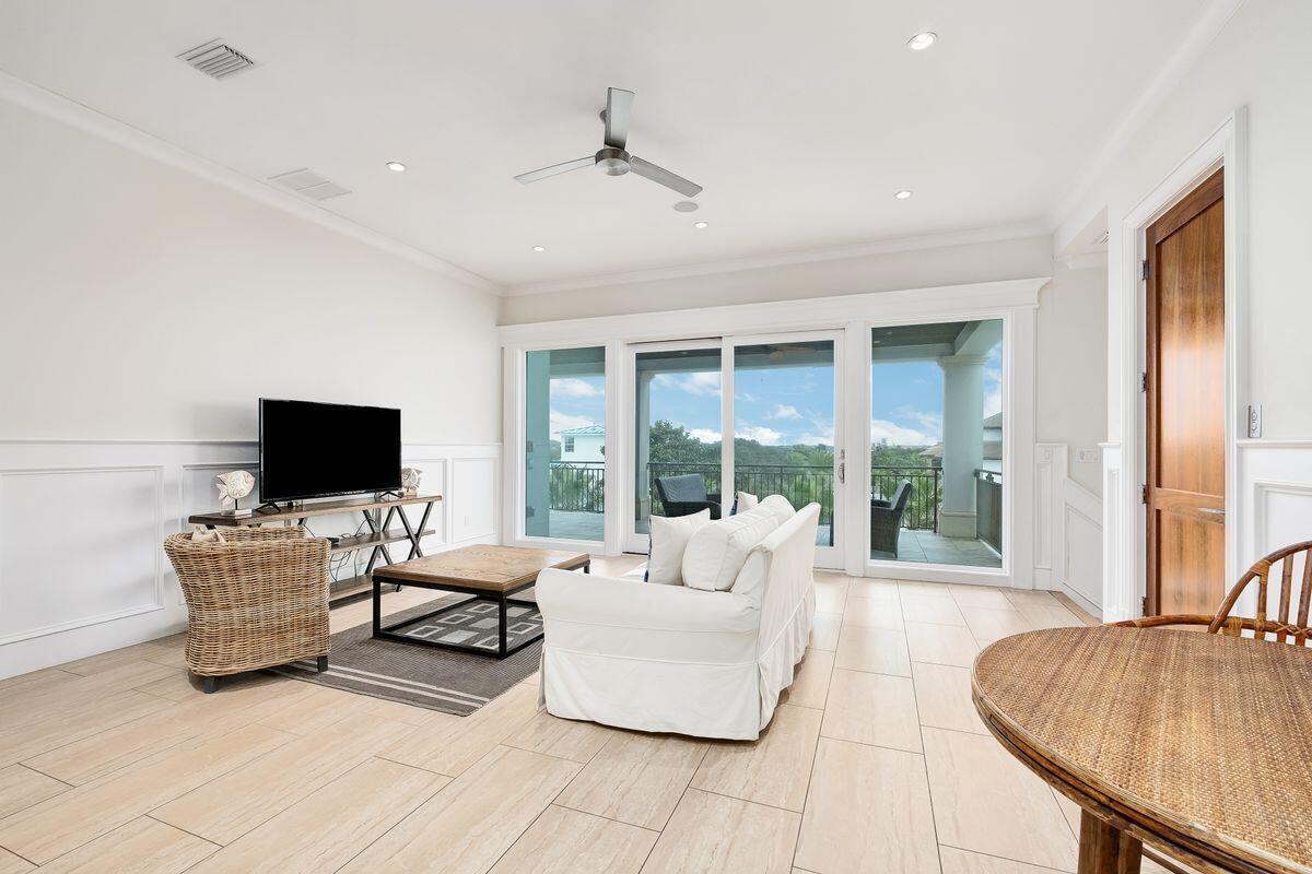 55 Sunfish Street Destin, FL 32541 - Photo 43 of 49 a living room with furniture and a flat screen tv