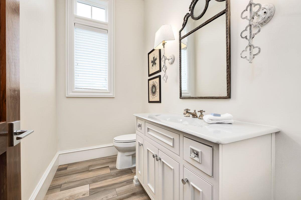 55 Sunfish Street Destin, FL 32541 - Photo 10 of 49 a bathroom with a sink a toilet and a mirror
