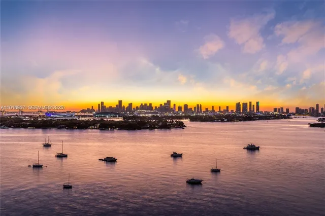 a dining room with couch and a large window