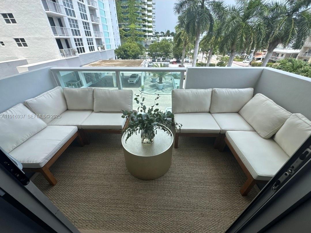 1200 West Avenue, Unit 316 Miami Beach, FL 33139 - Photo 12 of 44 a view of a patio with couches and a potted plant on a table