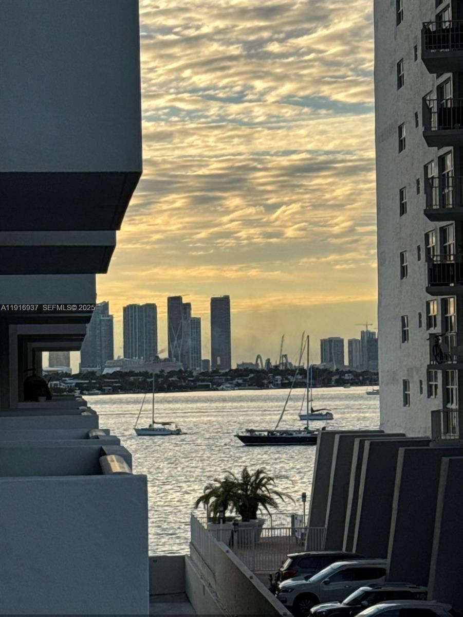 1200 West Avenue, Unit 316 Miami Beach, FL 33139 - Photo 13 of 44 a view of a balcony with wooden floor