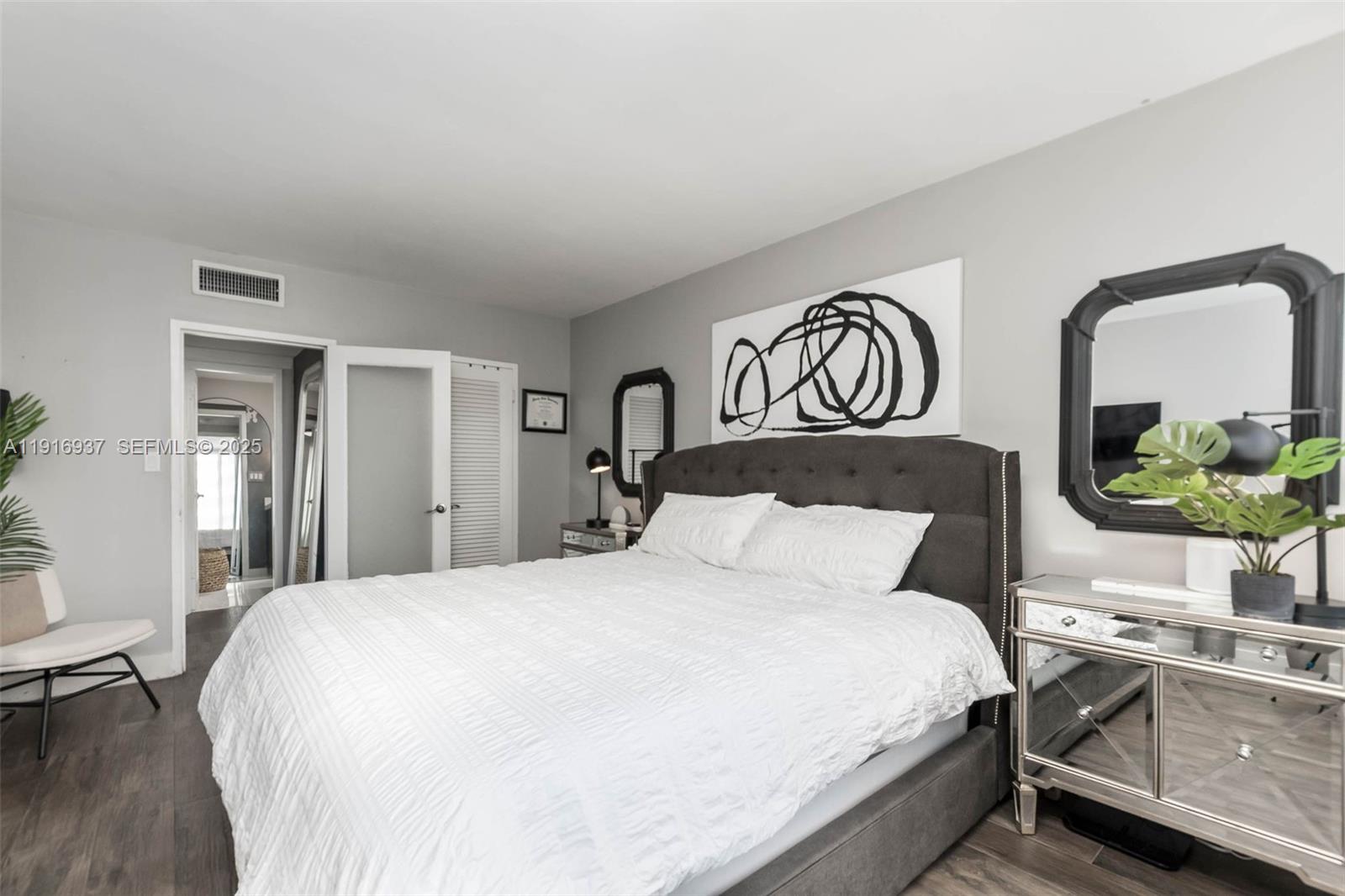 1200 West Avenue, Unit 316 Miami Beach, FL 33139 - Photo 15 of 44 a bedroom with a bed and a table