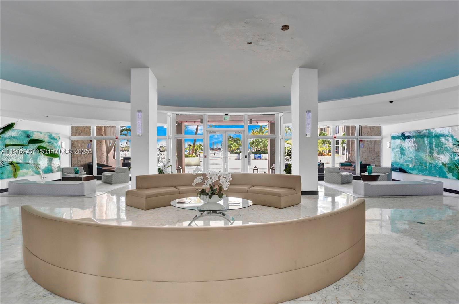 1200 West Avenue, Unit 316 Miami Beach, FL 33139 - Photo 2 of 44 a dining room with couch and a large window