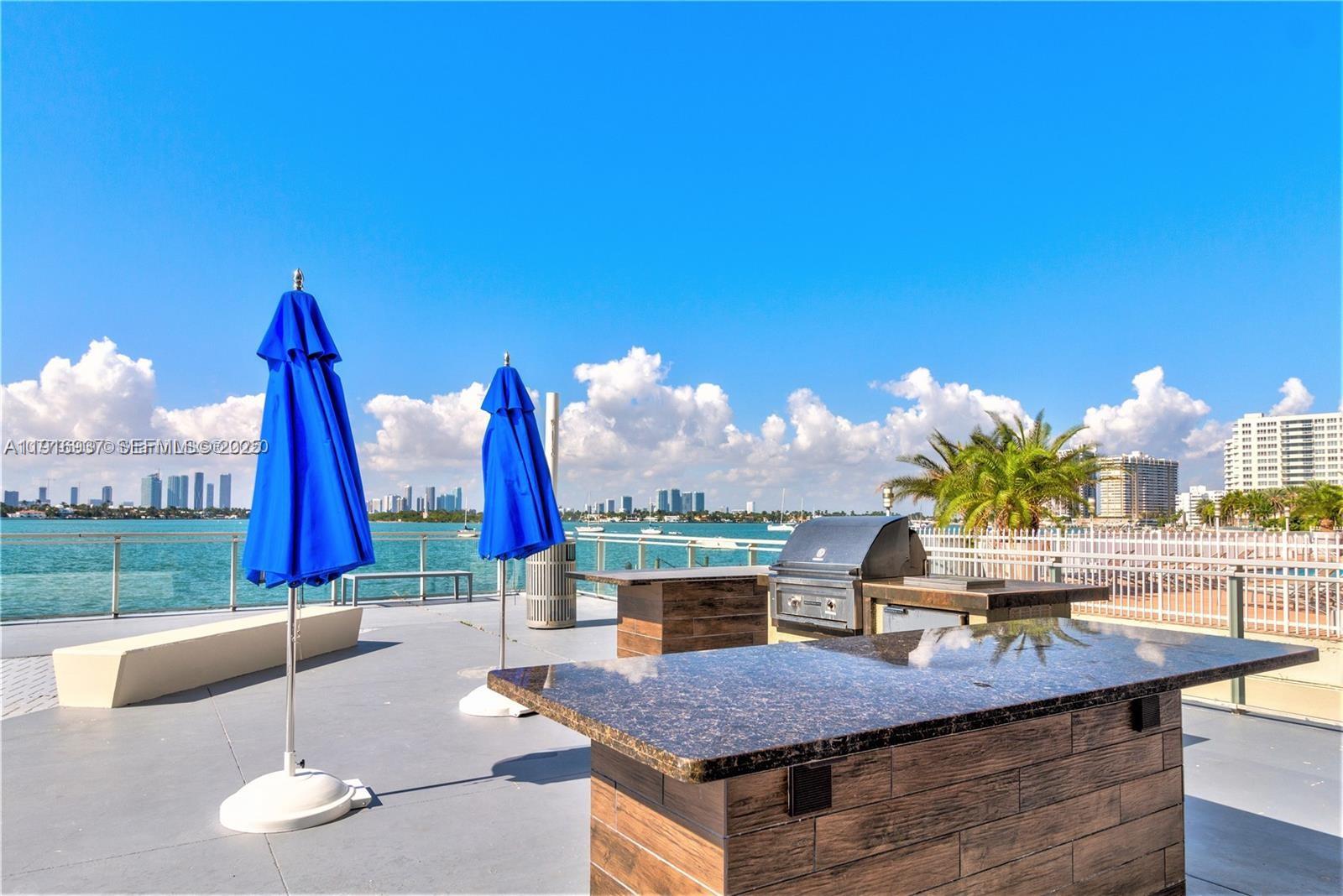 1200 West Avenue, Unit 316 Miami Beach, FL 33139 - Photo 37 of 44 a view of a terrace with couches and table