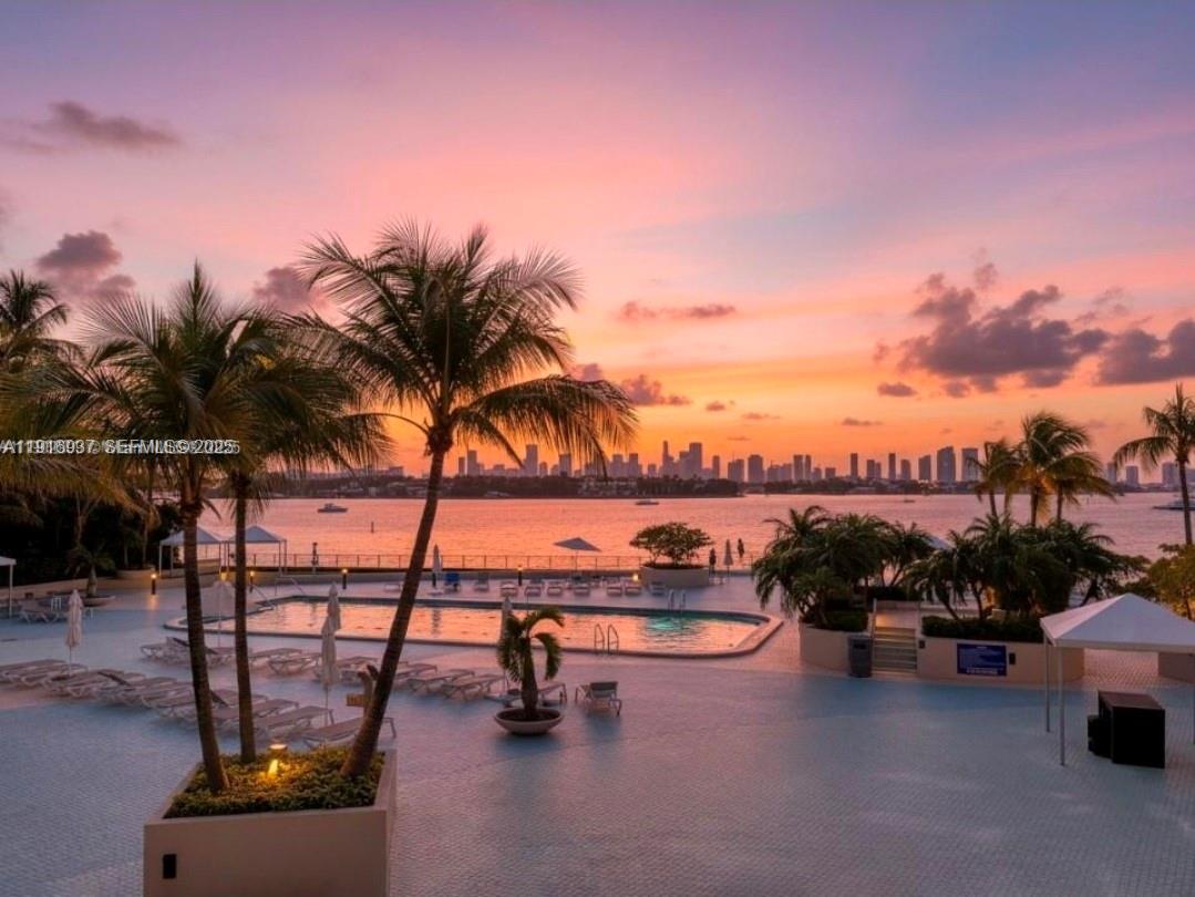 1200 West Avenue, Unit 316 Miami Beach, FL 33139 - Photo 38 of 44 a view of a swimming pool with lounge chair