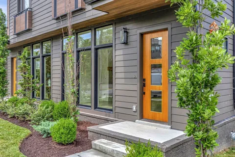 a front view of a house with a yard