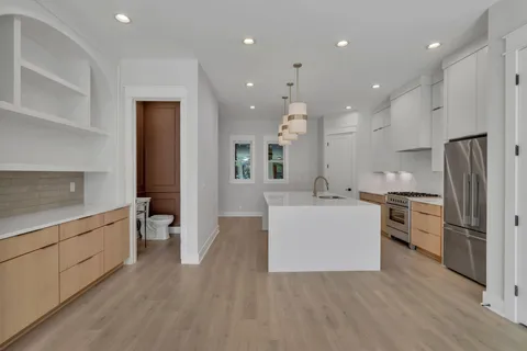 a bathroom with a sink toilet and a mirror