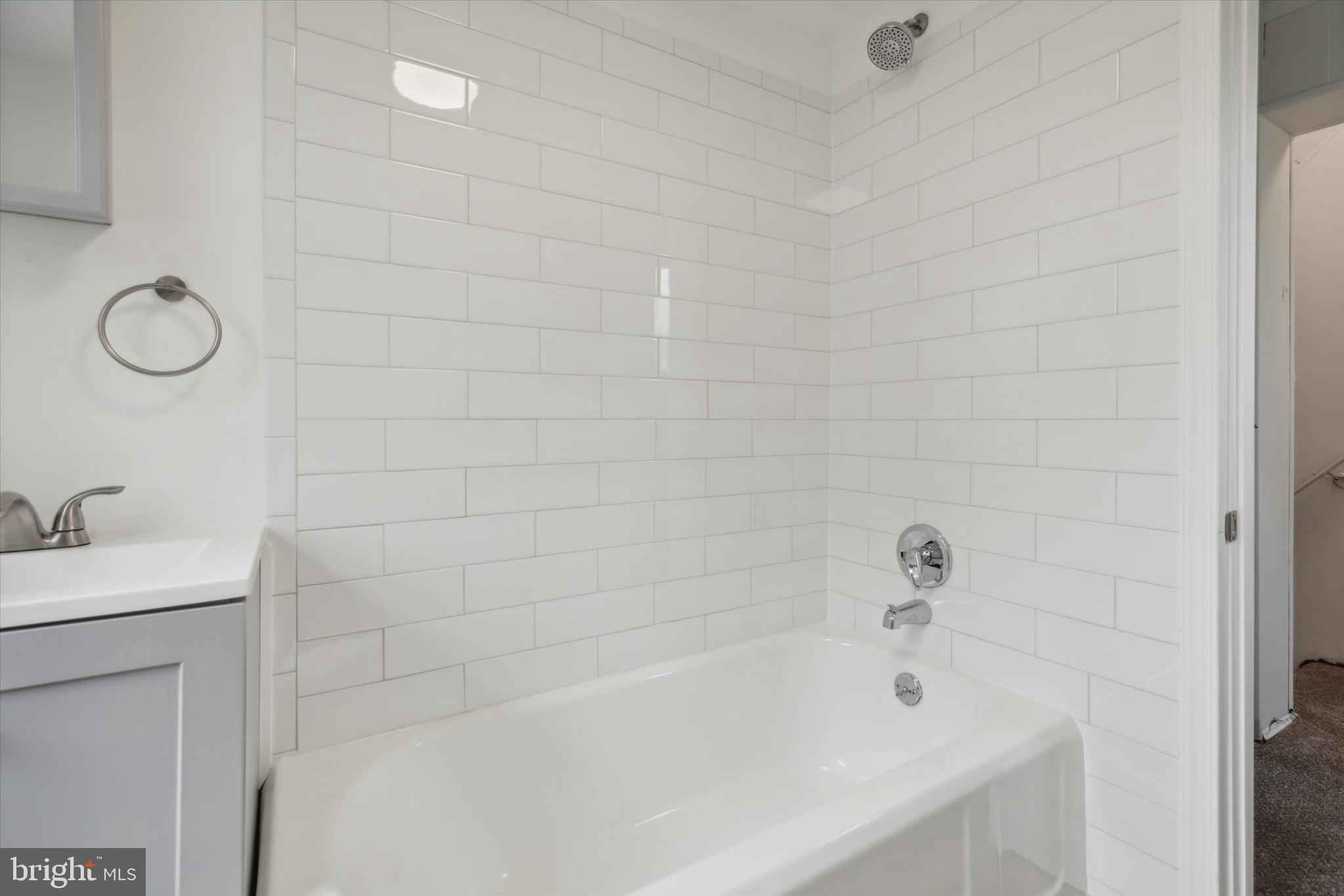 823 Coates Street Bridgeport, PA 19405 - Photo 18 of 20 a bathroom with a tub a sink and a shower