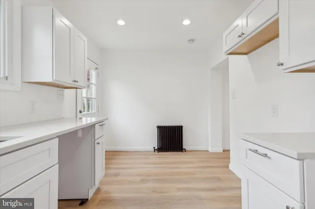 a view of kitchen and wooden floor