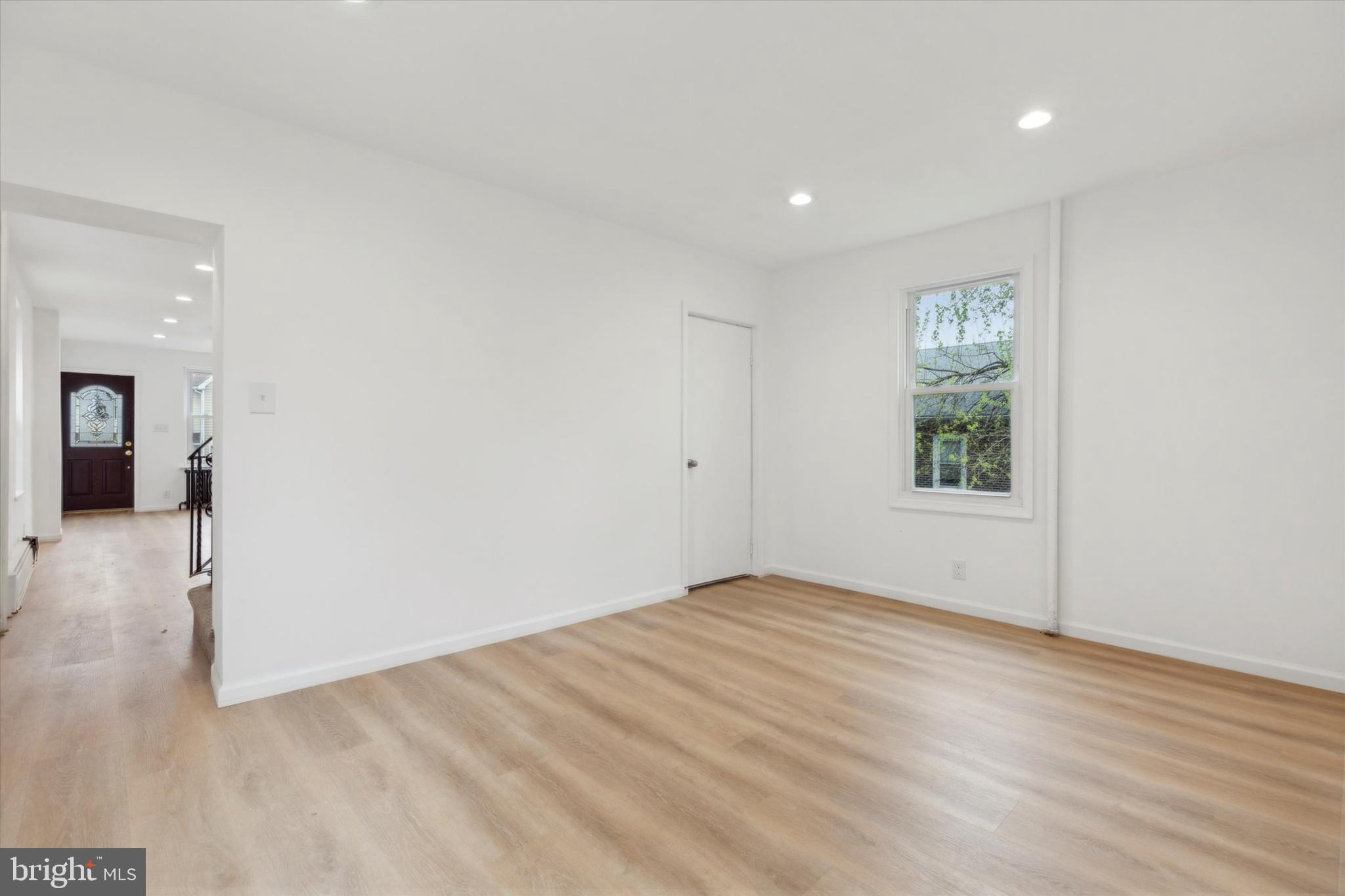 823 Coates Street Bridgeport, PA 19405 - Photo 4 of 20 wooden floor in an empty room with a window