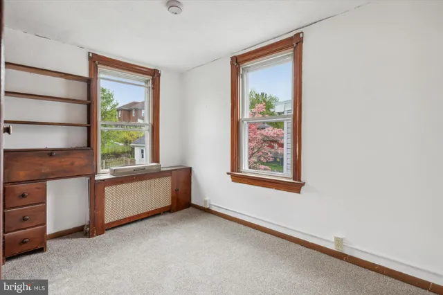 a room with window and cabinet