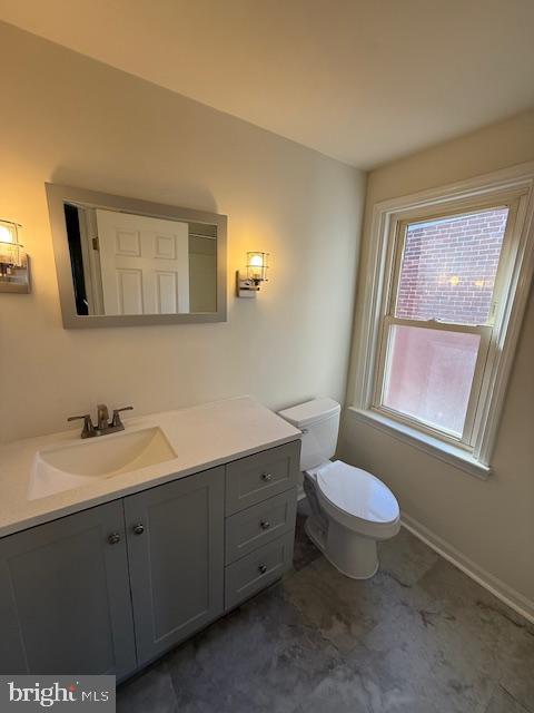 258 North 4th Street Perkasie, PA 18944 - Photo 7 of 15 a bathroom with a toilet sink and mirror