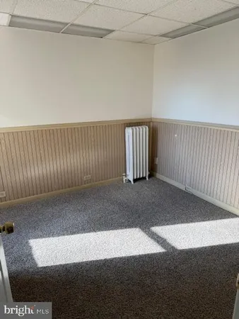 a view of a livingroom with a floor to ceiling window
