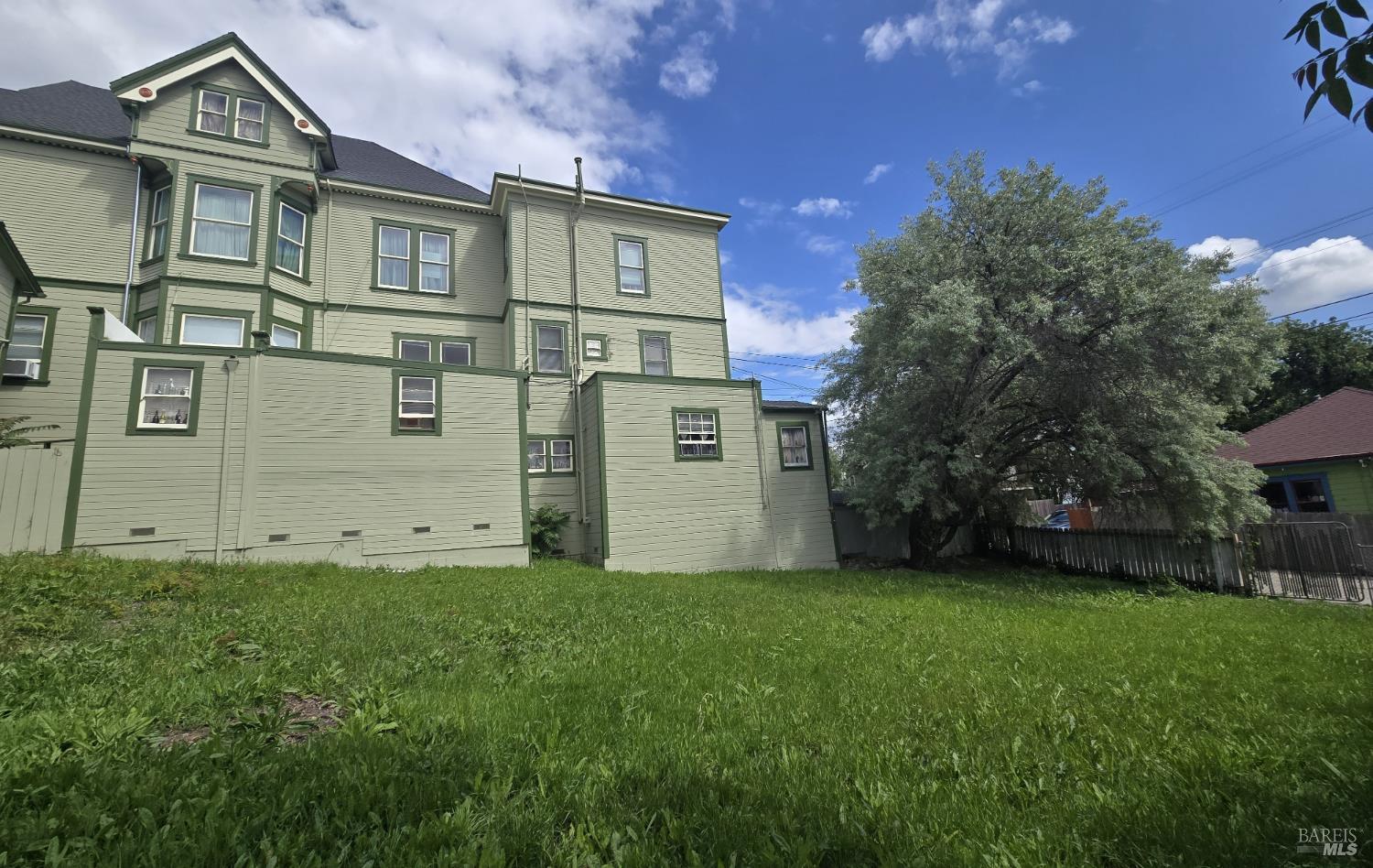 613 Georgia Street Vallejo, CA 94590 - Photo 10 of 19 a view of a big house with a big yard and large trees