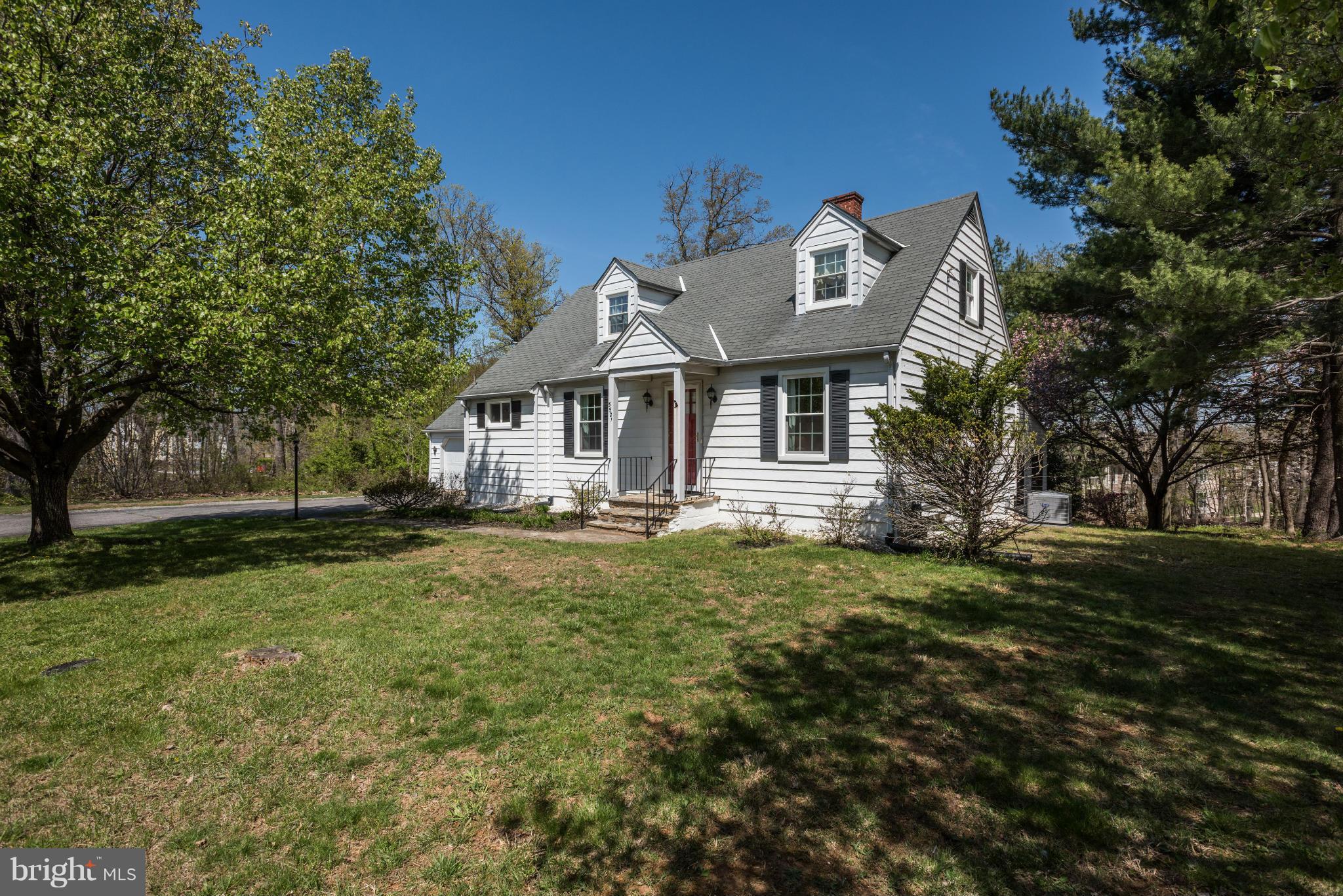 5521 Waterloo Road Ellicott City, MD 21043 - Photo 1 of 30 a front view of a house with a garden