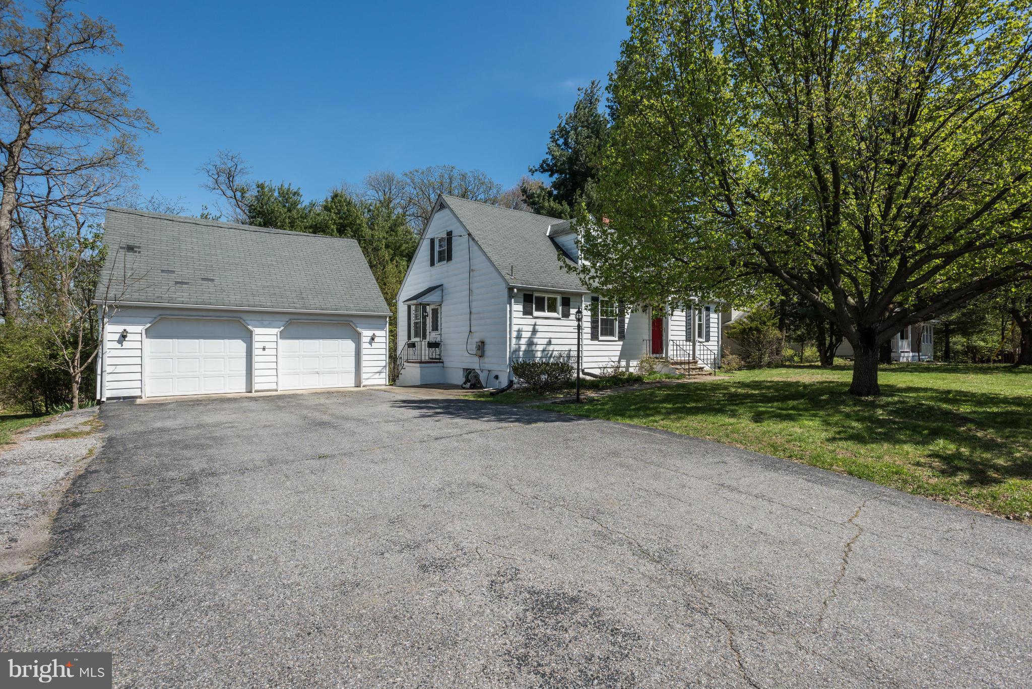 5521 Waterloo Road Ellicott City, MD 21043 - Photo 2 of 30 a view of a house with a yard and garage