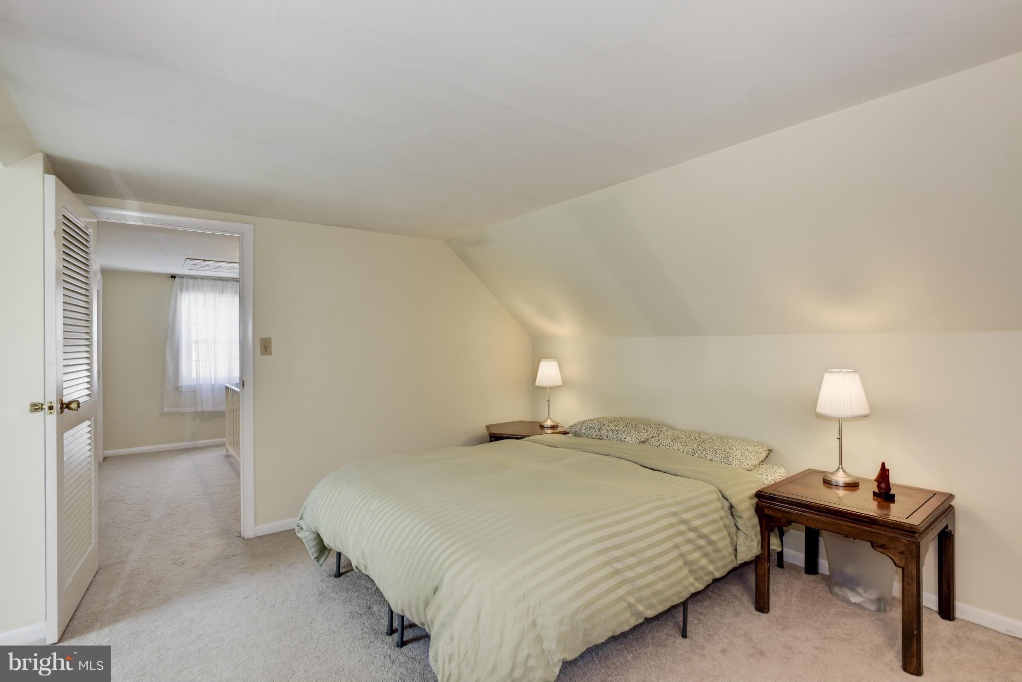 5521 Waterloo Road Ellicott City, MD 21043 - Photo 22 of 30 a bedroom with a bed and a lamp on table
