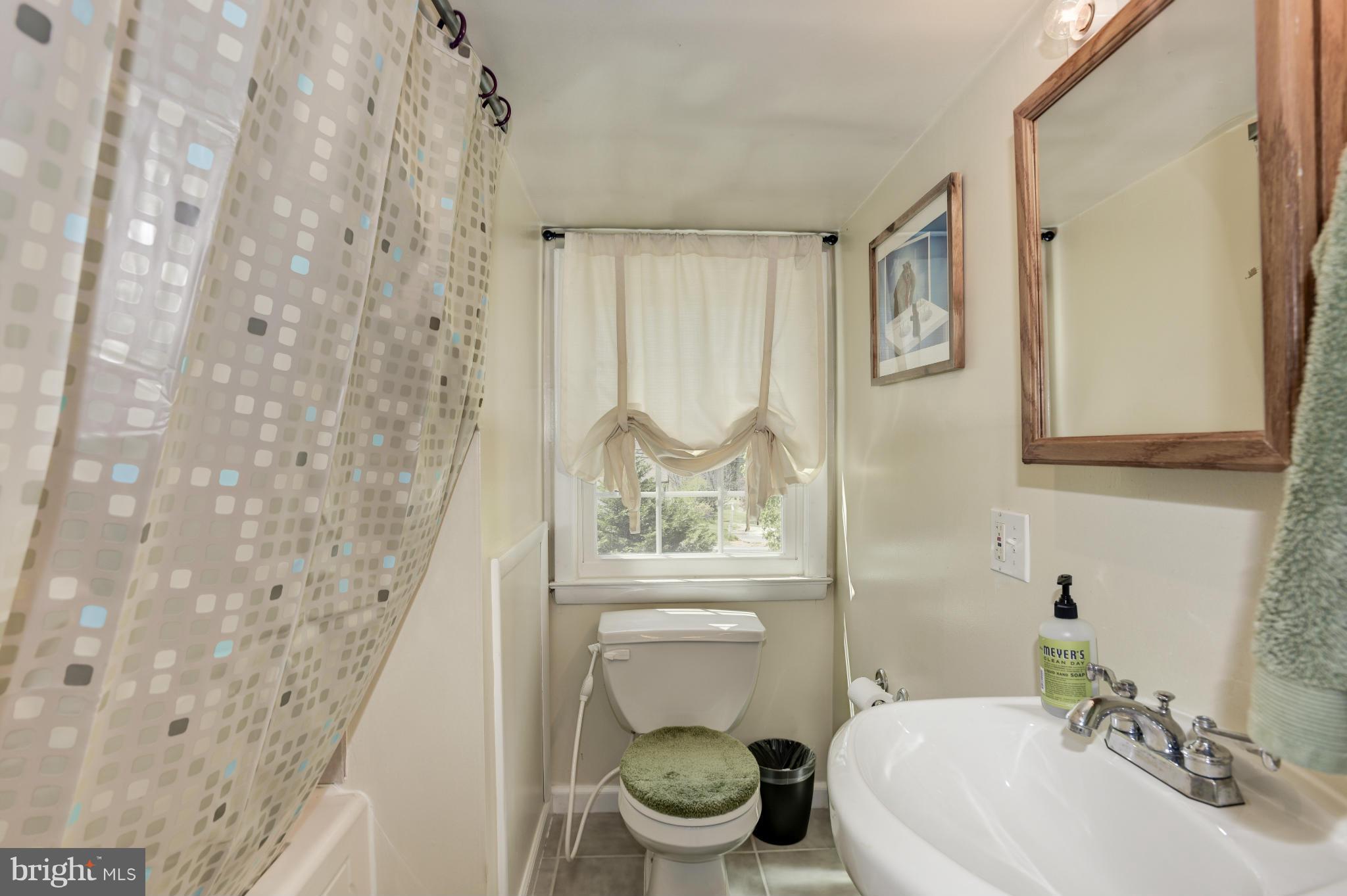 5521 Waterloo Road Ellicott City, MD 21043 - Photo 26 of 30 a bathroom with a toilet sink and mirror